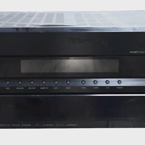 May include: A black Onkyo audio-video receiver featuring a large volume knob on the right, a central digital display, and a row of input selection buttons. The front panel displays the Onkyo logo, THX certification, and WRAT technology branding.