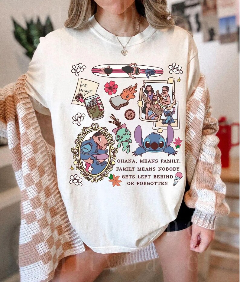 Peut inclure: T-shirt cr&egrave;me avec des illustrations de personnages et de sc&egrave;nes de dessins anim&eacute;s. Le t-shirt comprend le texte "OHANA, MEANS FAMILY. FAMILY MEANS NOBODY GETS LEFT BEHIND OR FORGOTTEN."