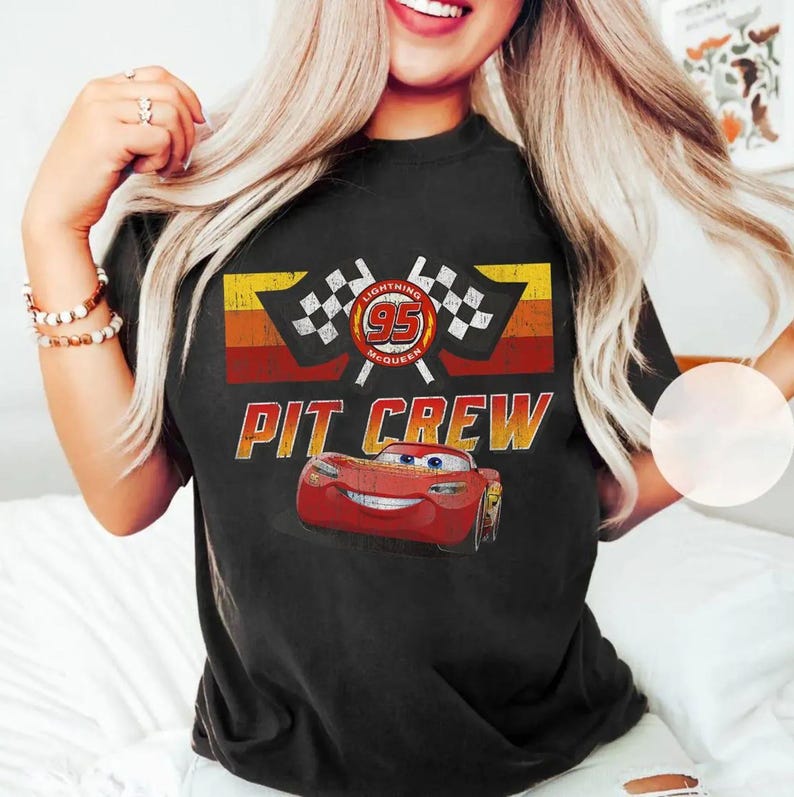 May include: A white ceramic mug with a black handle and the text "But First, Coffee" in a black, bold font. The mug is on a white surface.