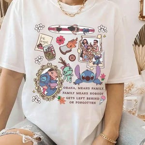 Peut inclure: T-shirt blanc avec un motif graphique color&eacute; repr&eacute;sentant des personnages de dessins anim&eacute;s et le texte "OHANA, MEANS FAMILY. FAMILY MEANS NOBODY GETS LEFT BEHIND OR FORGOTTEN." Le motif comprend un portrait encadr&eacute; et d'autres illustrations.