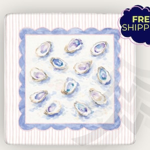 May include: Square decorative tray with a watercolor design of oysters. The tray features a scalloped blue border and a striped pink and white background. The oysters are in shades of purple, blue, and white.