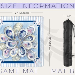 May include: A square game mat with a watercolor oyster design, measuring 21 inches (53.3cm) on each side. The mat features a blue and white striped border and comes with a black mat bag.