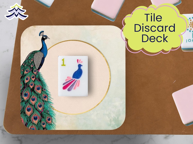 May include: A decorative tile discard deck featuring a peacock illustration. The deck includes a tile with a peacock design and the number 1. The words "Tile Discard Deck" are in a yellow cloud-shaped text box. The background is a mix of brown and light green.