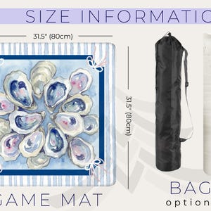 May include: A game mat with a watercolor design of oysters, measuring 31.5 inches (80cm) square. The mat has a blue and white striped border and a navy blue frame around the oyster design. The words "GAME MAT" are at the bottom.