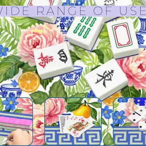 May include: White Mahjong tiles with red, green, and black symbols are scattered on a floral background with the text "WIDE RANGE OF USES". The background features pink flowers, blue accents, and a blue and white border.