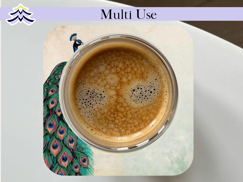 May include: A clear glass cup filled with coffee sits on a coaster. The coaster features a peacock design with teal, blue, and gold feathers. The words "Multi Use" are printed on the top of the image.