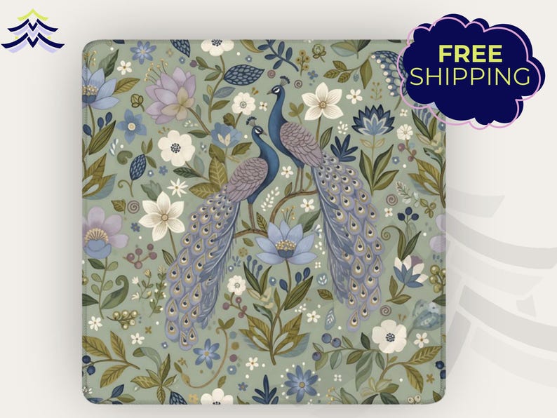 May include: Square decorative item with a floral and peacock design. The background is a muted green with white, blue, and purple flowers. Two blue peacocks are perched on a branch. The text "FREE SHIPPING" is in a dark blue cloud.