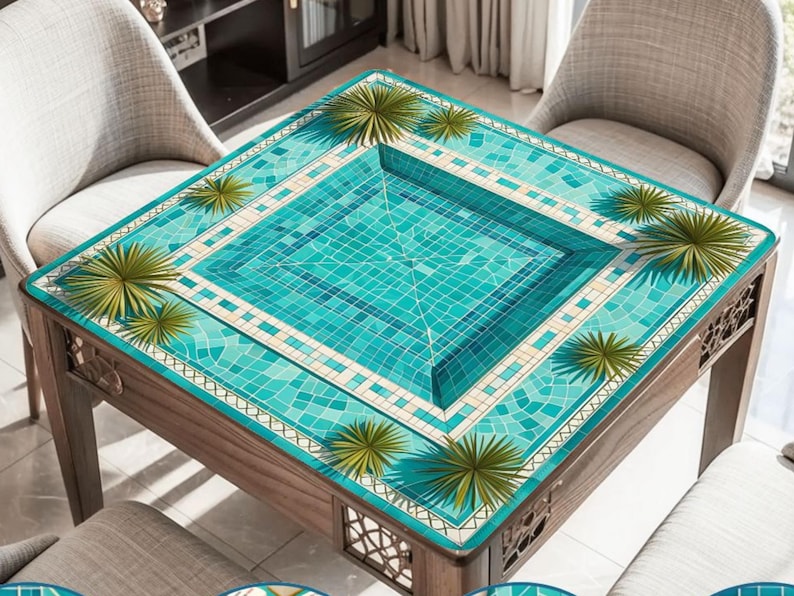 May include: A square wooden table with a turquoise mosaic tile design resembling a swimming pool. The table has a dark wood frame and is surrounded by chairs. Green palm frond accents are placed around the pool design.