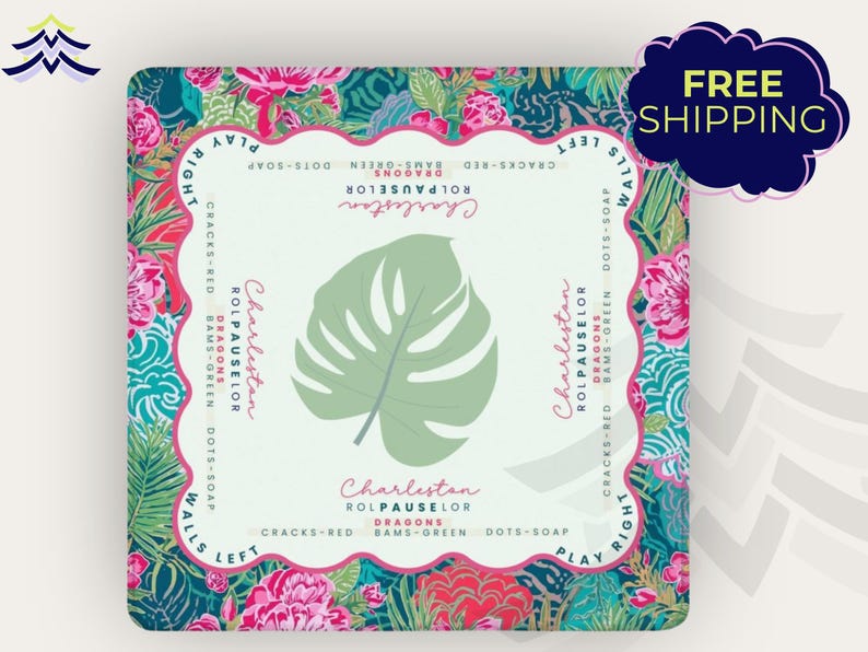 May include: Square decorative item with a tropical floral design in shades of pink, teal, and green. The center features a large, light green monstera leaf. Text includes "Charleston" and other phrases.