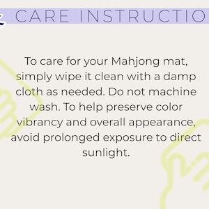 May include: A light beige care instruction card for a Mahjong mat featuring a purple header with the text CARE INSTRUCTIONS and a stylised logo. The text provides cleaning directions, advising to wipe with a damp cloth and avoid sunlight.