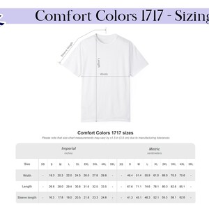 May include: A white t-shirt sizing chart for Comfort Colors 1717. The graphic displays a t-shirt outline with lines indicating length, width, and sleeve length. A table below provides measurements in centimetres for sizes S through 5XL.