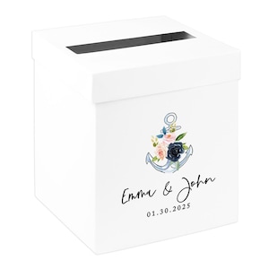 May include: White card box with a slot on top, featuring a watercolor anchor design with flowers in pink, blue, and navy. The box is personalized with the names "Emma & John" and the date 01.30.2025.