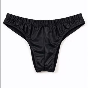 May include: Black underwear with a low-rise design. The fabric has a shiny, satin-like appearance. The waistband is elasticized, and the edges are finished with a contrasting trim. The garment is displayed against a white background.
