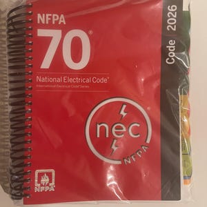 May include: A red spiral-bound book titled "NFPA 70 National Electrical Code." The cover features the number "70" in large white font, the "nec" logo, and the text "Code 2026."