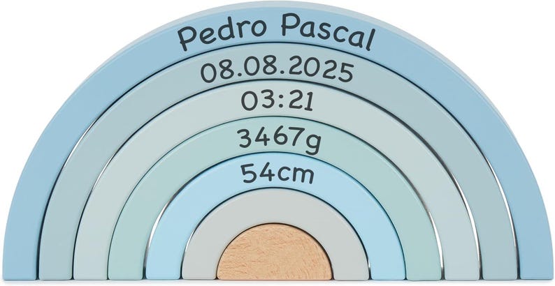 May include: A wooden rainbow stacker toy featuring five nested arches in shades of blue, light blue, and natural wood. The arches are printed with the text Pedro Pascal, 08.08.2025, 03:21, 3467g, and 54cm in a dark font across the curved surfaces.
