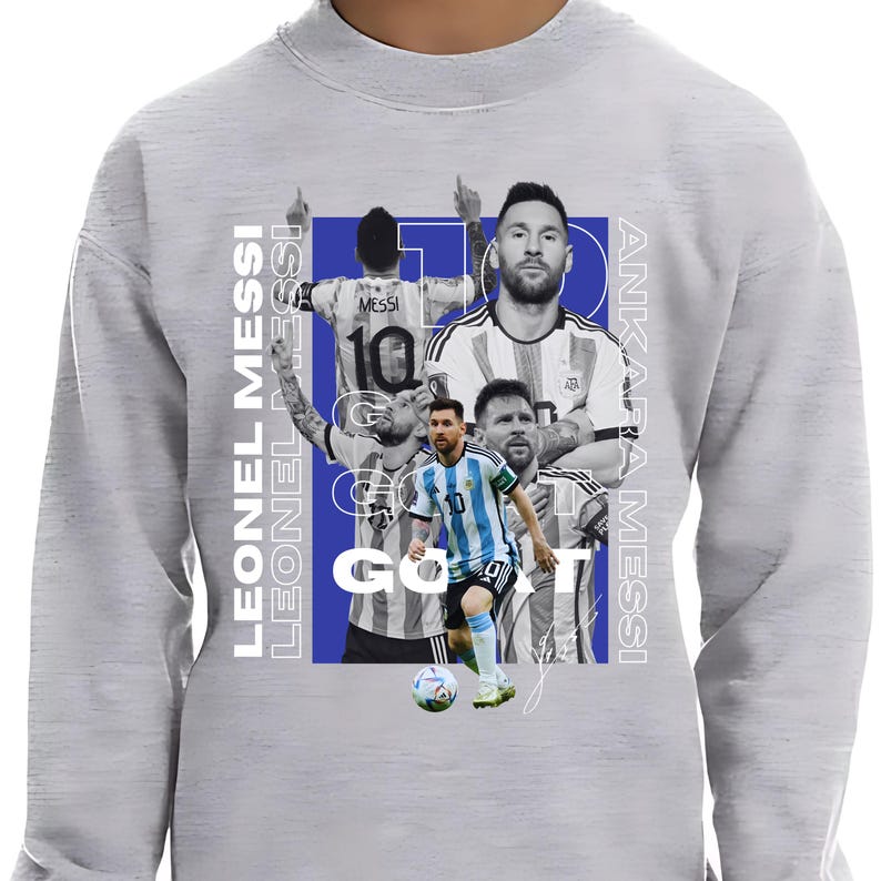 May include: Pale grey sweatshirt with a collage of Lionel Messi images, the words "LEONEL MESSI" and "ANKARA MESSI" in white. The design includes the word "GOAT" and Messi's jersey number 10.