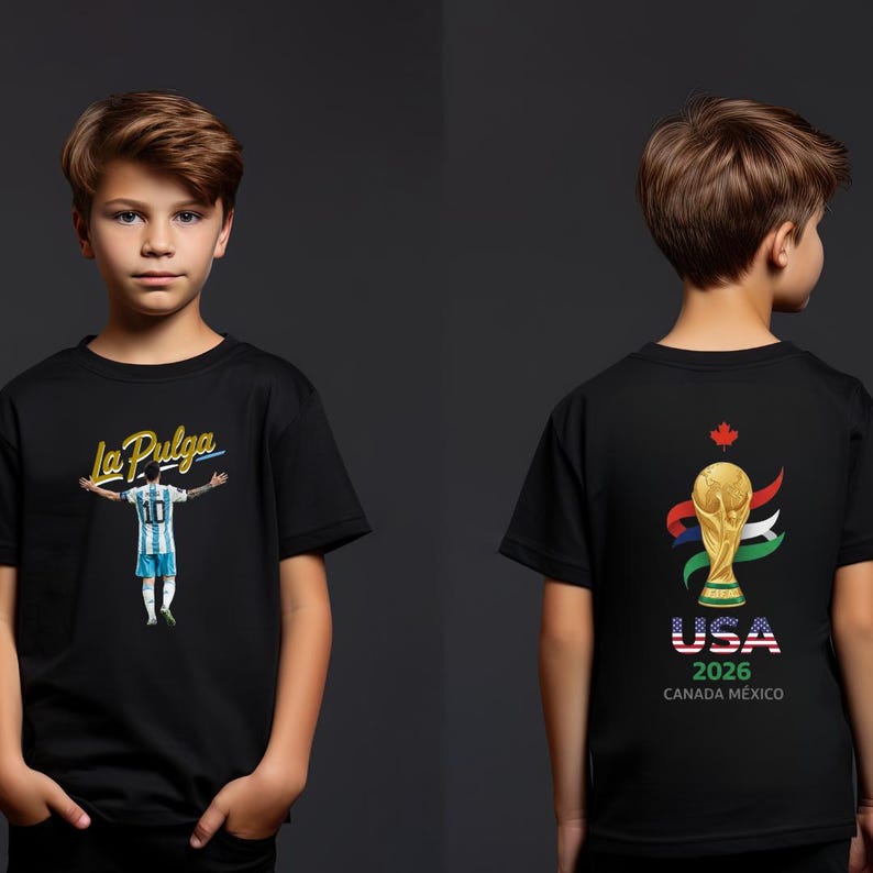 May include: Black t-shirt featuring a soccer player with the text "La Pulga" and the number 10. The back of the shirt displays the World Cup trophy with "USA 2026 CANADA MEXICO" text. The shirt is worn by a young person.