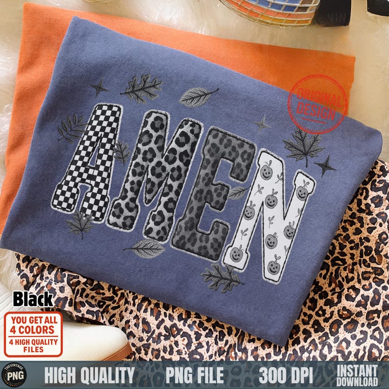 Amen PNG Christian fall design in black and gray patchwork letters on folded tee