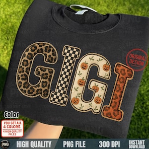 Puede incluir: Sudadera negra con la palabra "GIGI" en varios estampados. La "G" es de estampado de leopardo, la primera "I" es un tablero de ajedrez en blanco y negro, la segunda "G" tiene calabazas y la última "I" es de estampado de leopardo. El diseño incluye el texto "ORIGINAL DESIGN".