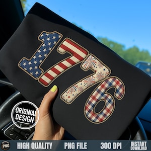 May include: Black fabric featuring the number "1776" in patriotic designs. The "1" is blue with white stars, the "7" has red and white stripes, the second "7" has fireworks, and the "6" has a red and blue plaid pattern.