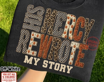 May include: Black sweatshirt with the text "HIS MERCY REWROTE MY STORY" in a mix of checkered, leopard print, and pumpkin-themed fonts. The design includes the words "Off-White", "PNG File", and "Instant Download".
