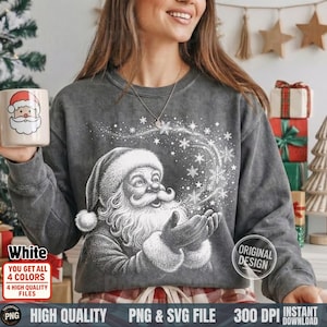 May include: A gray sweatshirt with a white Santa Claus graphic blowing snowflakes. The image includes a white mug with a Santa Claus design. Text on the image includes "White", "Original Design", and "PNG & SVG File".