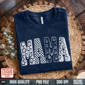 Navy folded shirt on basket: White MAMA design with fall motifs on navy shirt, embroidery illusion