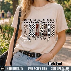 May include: Beige t-shirt with the text "DON'T GET ENOUGH CREDIT for the things I'M ABOUT Not to Say" in black font. The design includes checkered, leopard print, and lightning bolt graphics. The shirt is high quality and available as a PNG & SVG file.