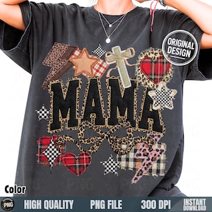 May include: Dark gray t-shirt with the word "MAMA" in large, black, leopard-print letters. The shirt features various patches, including stars, hearts, and a cross, in plaid, leopard, and lightning bolt designs. The words "ORIGINAL DESIGN" are in a white circle.