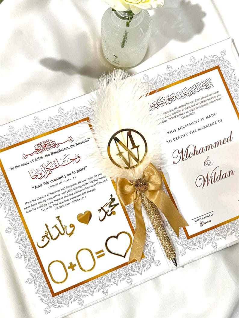 Custom Muslim marriage contract inside a velvet Nikkah certificate booklet with a matching keepsake box for an Islamic wedding ceremony. It also comes up with a feather pen.