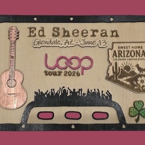 May include: A rectangular wooden plaque featuring a laser-engraved acoustic guitar, the text Ed Sheeran, Glendale, AZ - June 13, and loop tour 2026. It includes a map of Arizona with a cactus and bird, a crowd silhouette, and a green shamrock icon.