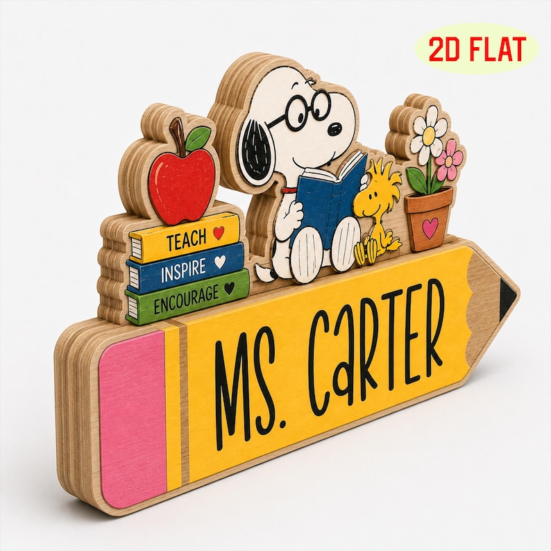 May include: A layered wooden desk sign shaped like a yellow pencil with a pink eraser, featuring the text MS. CARTER. It includes a cutout of Snoopy reading a book, Woodstock, a red apple, and a potted flower, plus three books labeled TEACH, INSPIRE, and ENCOURAGE.