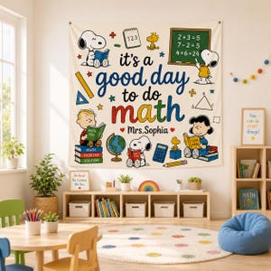 May include: A rectangular wall tapestry featuring Snoopy and friends with the text it's a good day to do math and Mrs. Sophia. The design includes colorful illustrations of math tools, books, a globe, a calculator, and a chalkboard with equations.