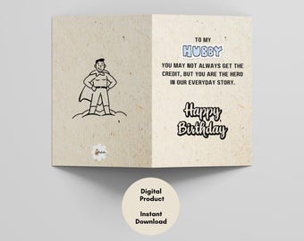 May include: A folded birthday card with a superhero illustration and the words "To My Hubby." The card's message reads, "You may not always get the credit, but you are the hero in our everyday story." The words "Happy Birthday" are also displayed.