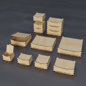 May include: A collection of light-colored wooden boxes of various sizes and shapes, featuring interlocking finger joints at the corners. Some boxes are open with lids attached, while others are closed, showcasing a natural wood grain finish.