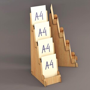 May include: A wooden display stand with multiple tiered shelves, holding several white A4-sized papers with the text "A4" in blue. The stand is made of light-colored wood and is designed to showcase documents or promotional materials.