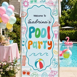 May include: A vertical sign with the text "Welcome to Sabrina's POOL PARTY" in colorful letters and illustrations of summer items like a beach ball, sunglasses, and watermelon. The sign is light blue with white stripes and is set up near a pool.