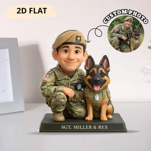 May include: A figurine of a soldier in camouflage uniform, kneeling beside a German Shepherd dog. The figurine has a smiling face and wears a beret. The base reads "SGT. MILLER & REX". A small photo shows the soldier and dog. The text "2D FLAT" is in the top left.