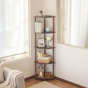 May include: A white ceramic mug with a black handle and the text "But First, Coffee" in a bold, black font. The mug is sitting on a wooden surface. The mug is 4 inches tall.