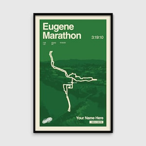May include: A framed poster with a green background features the text "Eugene Marathon" and a course map in white. The poster includes the time 3:19:10, and the text "Your Name Here" and "BIB # HERE".