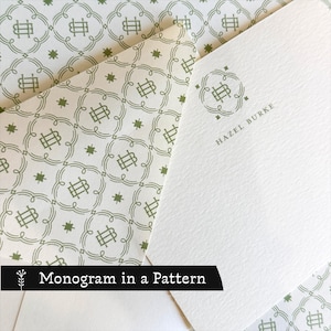 May include: A white stationery card and envelope featuring a sage green monogram logo and a repeating geometric pattern. The card displays the name HAZEL BURKE in sage green text below the monogram. The envelope liner has a matching pattern.
