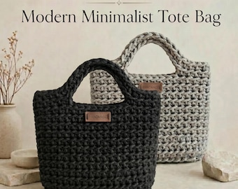 May include: A crochet pattern for a tote bag featuring text that reads Crochet Pattern, Modern Minimalist Tote Bag, and Instant Digital Access | Step-by-Step Guide. The image displays a black and a grey crocheted tote bag with a brown tag labelled Handmade.
