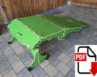 May include: A bright green, wooden, folding table with a unique, geometric design. The table is constructed from interlocking pieces and features a flat surface. The legs have small wheels. A PDF download icon is in the bottom right corner.