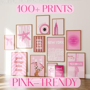 May include: A gallery wall collection of twelve rectangular wall art prints in various shades of pink. The prints feature diverse graphics including a bow, a star, a striped pattern, a city skyline, text reading "NEW YORK", "COOL GIRL LIVE HERE", "good things take time", "main character energy", "THIS IS MY HAPPY PLACE", "good vibes only", and a "ONE WAY" street sign.