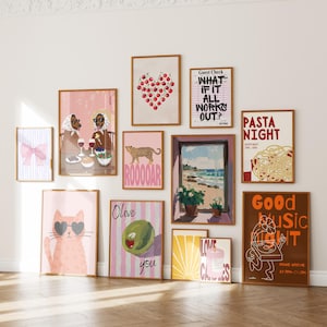 May include: A collection of framed art prints with various designs. The prints include a pink bow, a heart made of cherries, a leopard, a cat wearing sunglasses, and text that reads "WHAT IF IT ALL WORKS OUT?" and "PASTA NIGHT". The frames are brown.