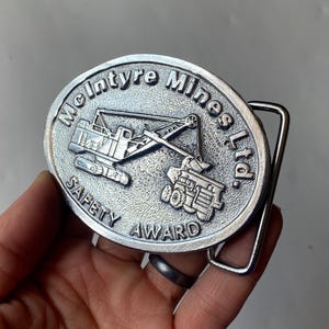 Vintage McIntyre Mines Safety Award Belt Buckle: Pewter Construction Mining Theme