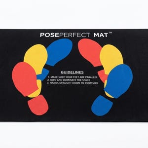 May include: A rectangular black mat featuring the text POSEPERFECT MAT and GUIDELINES with three numbered instructions. The surface displays colorful red, yellow, and blue foot-shaped outlines arranged to indicate proper standing positioning.
