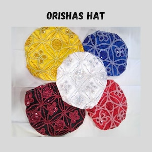 May include: Five colorful, round hats with intricate beaded and sequined designs. The hats are in yellow, blue, white, red, and black. The text "ORISHAS HAT" is at the top of the image.
