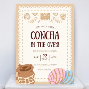 May include: A beige invitation card featuring a white scalloped border, brown text reading "Theres a little CONCHA IN THE OVEN!", and illustrations of a brown mug with cinnamon sticks, a pink concha, and a blue concha at the bottom.