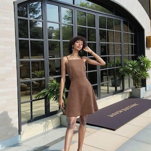 Brown linen sundress, sleeveless A-line, square neckline, lightweight summer outfit, minimalist and elegant for warm days